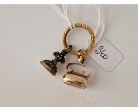 A Georgian gold cased seal with Amelia intaglio and a Victorian seal both attached to large Victorian split ring
