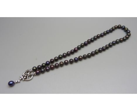 A string of pearls with a silver clasp set with cubic zirconia 