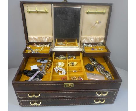 A large case of costume jewellery includes a 15ct gold and diamond stick pin and one other set with moonstones 