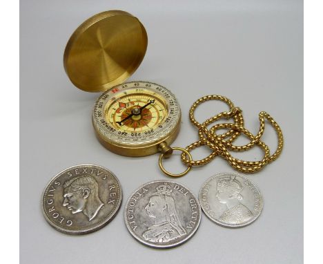 A 1901 India one Rupee coin, a South Africa 5 shillings coin, an 1890 florin and a compass with box marked Onyx of Nottingham