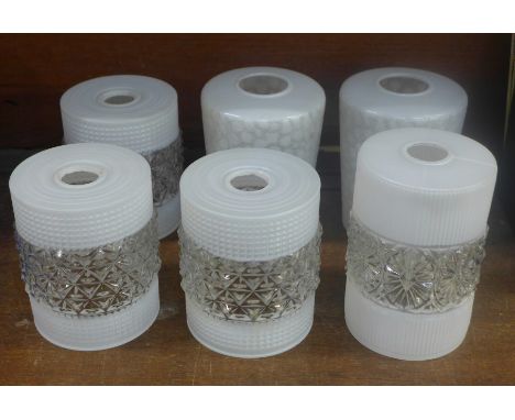A collection of six glass light shades; a pair, a set of three and one larger 