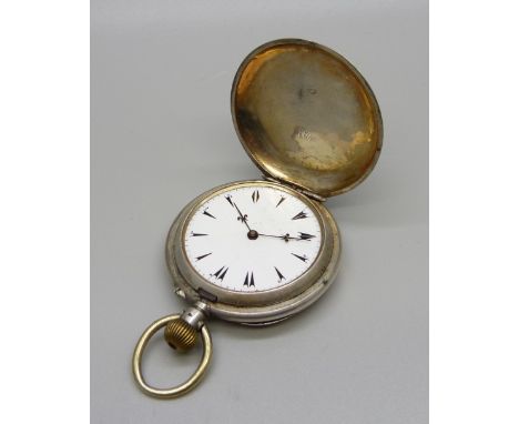 An 800 silver hunter pocket watch, lacking glass 