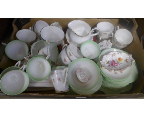 An English bone china tea set in green with rose decoration, other china cups and saucers, a Staffordshire flatback figure an