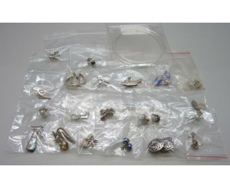 A collection of silver earrings 