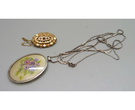 A Victorian 9ct gold, garnet and seed pearl set brooch, 4.1g, and a silver pendant and chain 