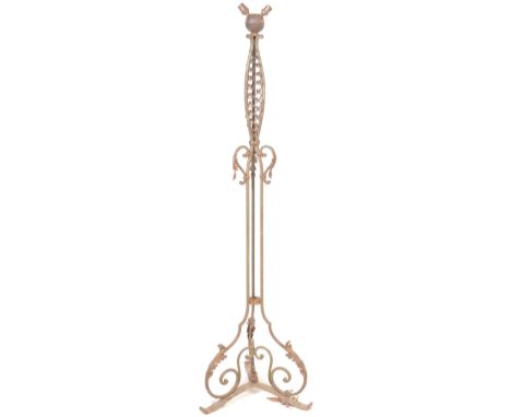 An early 20th century circa 1920’s cast metal floor standing lamp. The lamp having turned &nbsp;column decorated with foliate