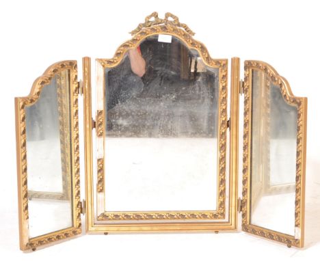 A 20th century rococo style triptych gilt frame mirror / dressing table mirror being decorated with foliate motifs. A/F&nbsp;