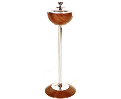 A vintage 20th century circa 1950s walnut and chrome ashtray stand having a push button mechanism over a single support raise