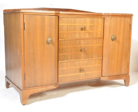 A vintage retro mid 20th century Art Deco style walnut sideboard credenza. The sideboard of a long rectangular form having a 