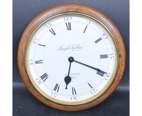An 20th century style railway station clock / post office clock. The wall hanging clock having white dial with roman numbers 