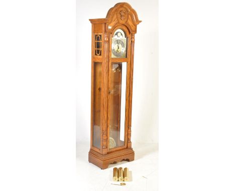 A Sligh of America grandfather clock with cable wound triple chime movement, Westminster, Whittington and St. Michael. Polish