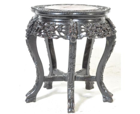 An early 20th century Chinese Oriental jardinière / planter having a stone centre panel with carved and pierced hardwood stan