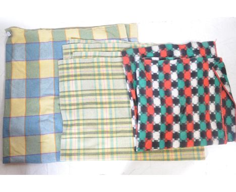 A collection of three vintage 20th century Welsh blankets comprising of a yellow and blue check blanket, one having red, gree