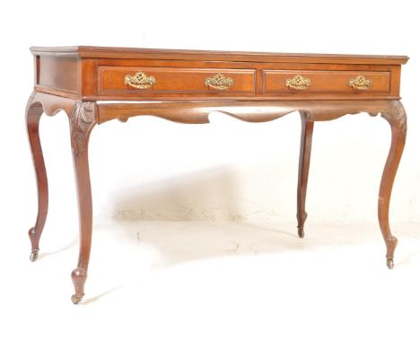 A 19th century Victorian mahogany console table / hall table having a flared top over twin drawers with ornate brass pulls ra
