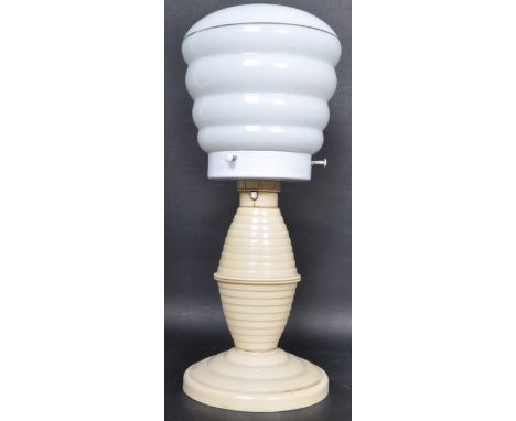 An early 20th century Bakelite Art Deco desk lamp / light. The lamp having a milk glass cylindrical shade with white Bakelite