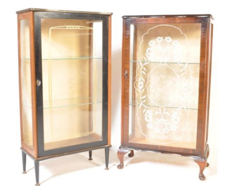 A pair of retro vintage 1950s walnut veneer china display cabinet vitrines. The cabinets having glazed doors and sides. The c