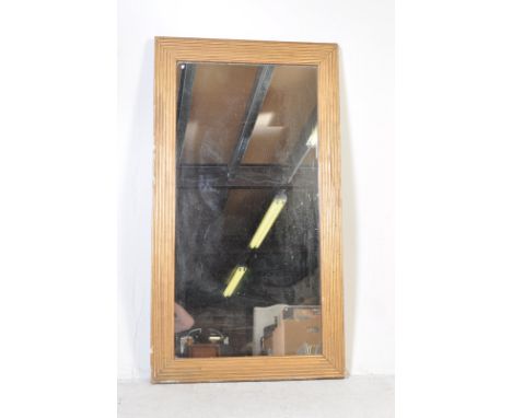 A late 19th century Victorian gilt mantle mirror / wall hanging mirror. The mirror of a large rectangular form with gilt shap