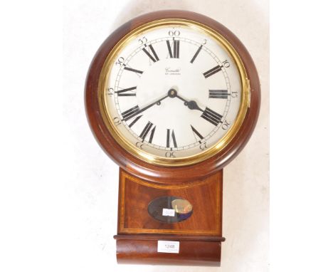 A 20th century mahogany case wall clock by Comitti Of London. The clock having a white dial with Roman numerals to the chapte