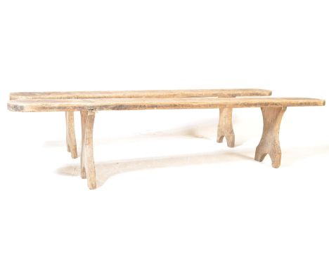 Two early 20th century French provincial / country elm wood refectory type pig bench of typical form having remains of paint 
