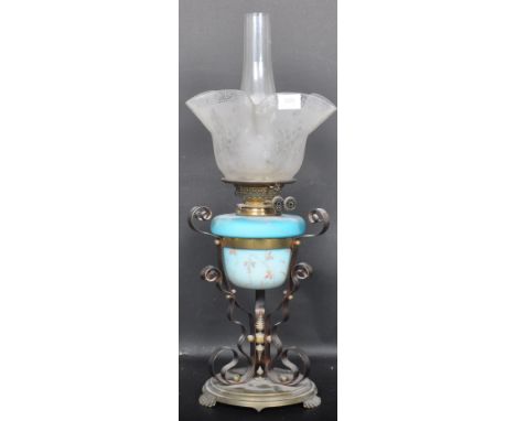 A 19th Century Victorian oil lamp / paraffin lamp having a blue glass reservoir with hand painted floral decoration . The oil