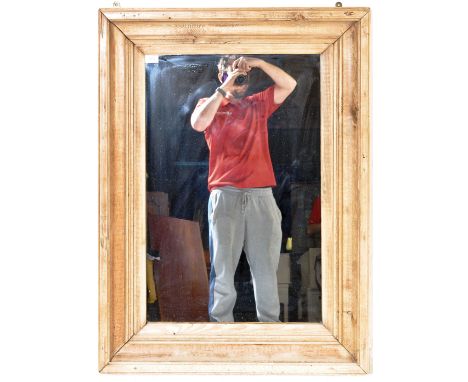 A large vintage 20th century wall hanging mirror of rectangular form having a stripped pine frame.&nbsp;Measures approx. 104c