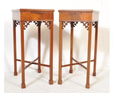 A pair of good quality Chinese Chippendale revival walnut bedside tables. Each raised on squared legs united by cross stretch