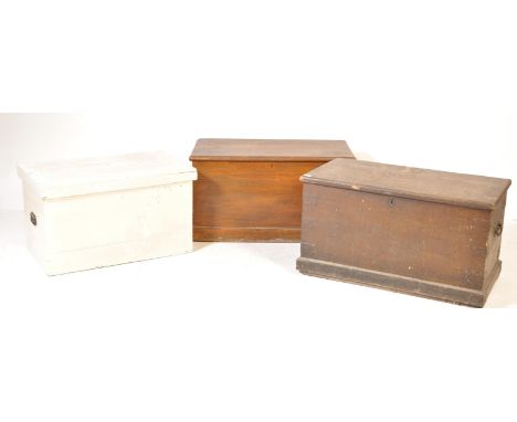 A collection of three vintage 20th century pine trunks / blanket boxes comprising of a painted chest having a hinged lid open