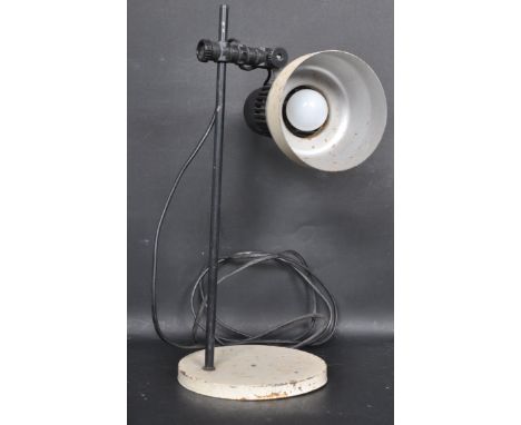 A retro vintage mid 20th Century industrial workmans rise and fall desk lamp light having cream enamel shade with cooling hol