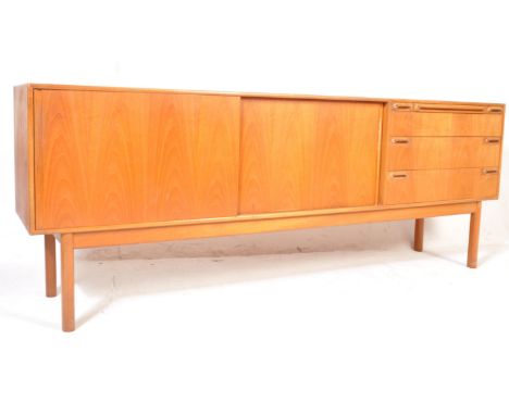 A vintage retro mid 20th century circa 1960’s teak wood&nbsp;McIntosh sideboard credenza. The sideboard of a long rectangular