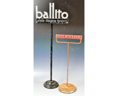 Two vintage 20th Century shop display advertising stands one for Ballito "ankle clinging hosiery" having a black metal frame 
