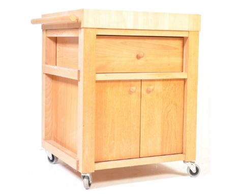 A vintage style wooden kitchen island / butchers block island. The island having a square butchers block top with single draw