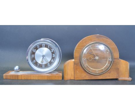 An early 20th century Art Deco chrome and walnut alarm clock / mantel clock by Peter. The clock having a silver circular dial