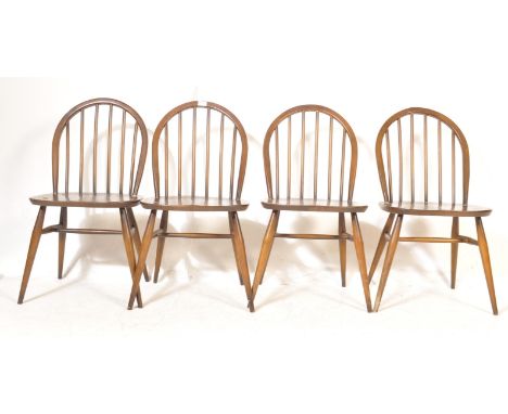 Ercol - Lucian Ercolani - A set of four retro vintage mid 20th century Windsor dining chairs having a hooped backrest, saddle