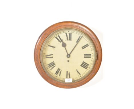 An antique early 20th century Victorian style mahogany station wall hanging / postman's / railway clock having a circular mah