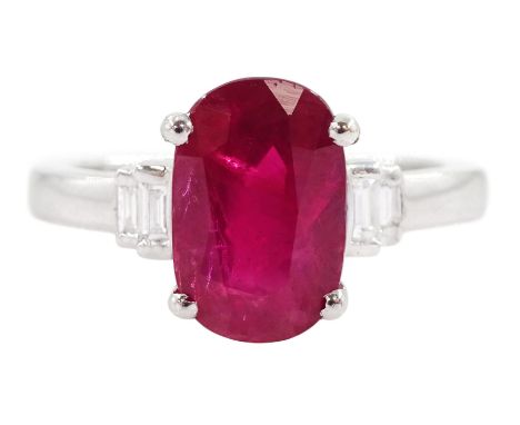 18ct white gold oval cut Burmese ruby ring, with two baguette cut diamonds set either side, hallmarked, ruby approx 3.00 cara