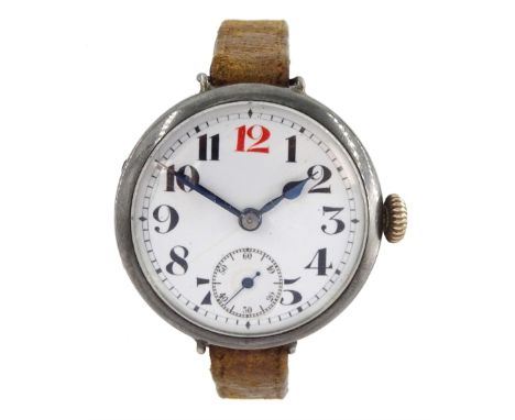 WWI silver trench wristwatch, white enamel dial with Arabic numerals, red 12 and subsidiary seconds dial, the back case engra