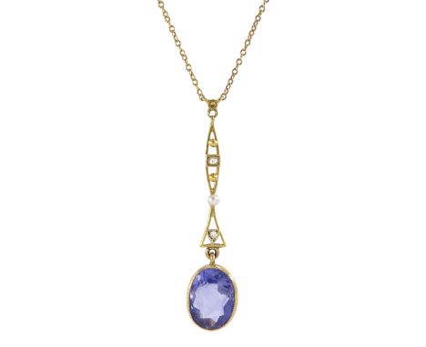 Early 20th century gold single stone oval cut sapphire, suspending from a pearl and diamond set pendant, on trace link chain 
