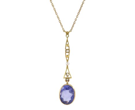 Early 20th century gold single stone oval cut sapphire, suspending from a pearl and diamond set pendant, on trace link chain 