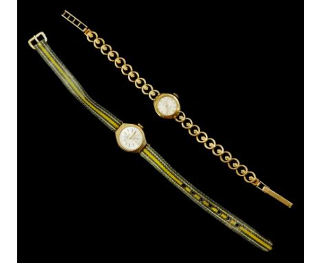 Two 9ct gold ladies manual wind wristwatches, one on integral 9ct gold bracelet, the other on a fabric strapCondition Report: