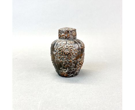 An early 20th century Chinese antimony tea caddy, relief decorated with chrysanthemums, H. 12cm.