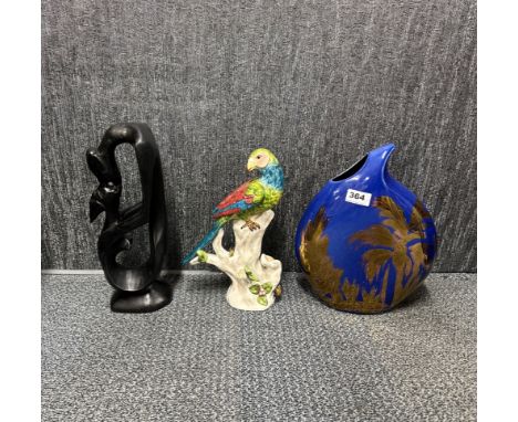 A signed handpainted Anita Harris Art Pottery vase, H. 32cm. Together with a ceramic parrot and a carved wooden figure.