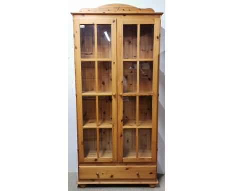 A four shelf pine and glass display cabinet, 179 x 85 x 30cm.