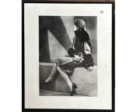 A large framed photographic print of a 1920's model, frame size 74 x 84cm.