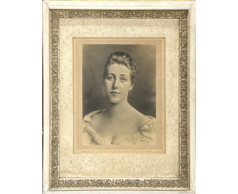 A large framed photographic portrait of a young woman by R. E. Ruddock of Grand Studio, Newcastle-on-Thyme, frame size 59 x 7
