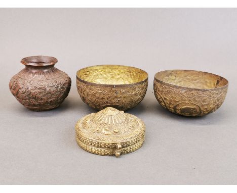 A Tibetan brass Ga'u (prayer box), H. 4cm, D. 9cm, together with two Indian brass bowls, and a further bronze vase.