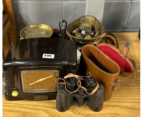 A kitchen scale and weights with a bakelite radio, binoculars and camera.