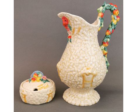 A Clarice Cliff Celtic Harvest pattern water jug and matching preserve pot, tallest H. 25cm.