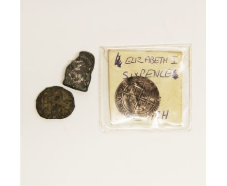An Elizabeth I stamped silver sixpence with two further early bronze coins.