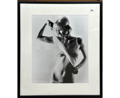 A large framed photographic print of a young female model, frame size 74 x 84cm.