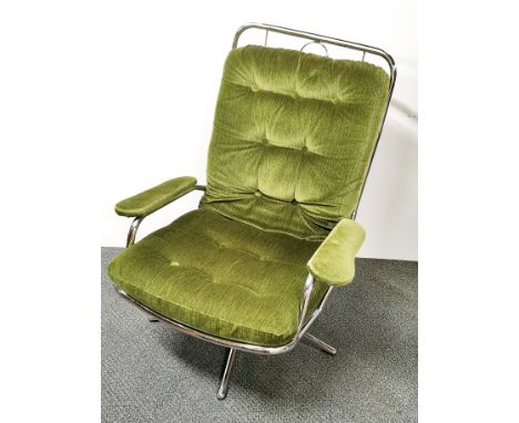 A swivel, metal framed button backed Charles Eames style armchair, H. 97cm.